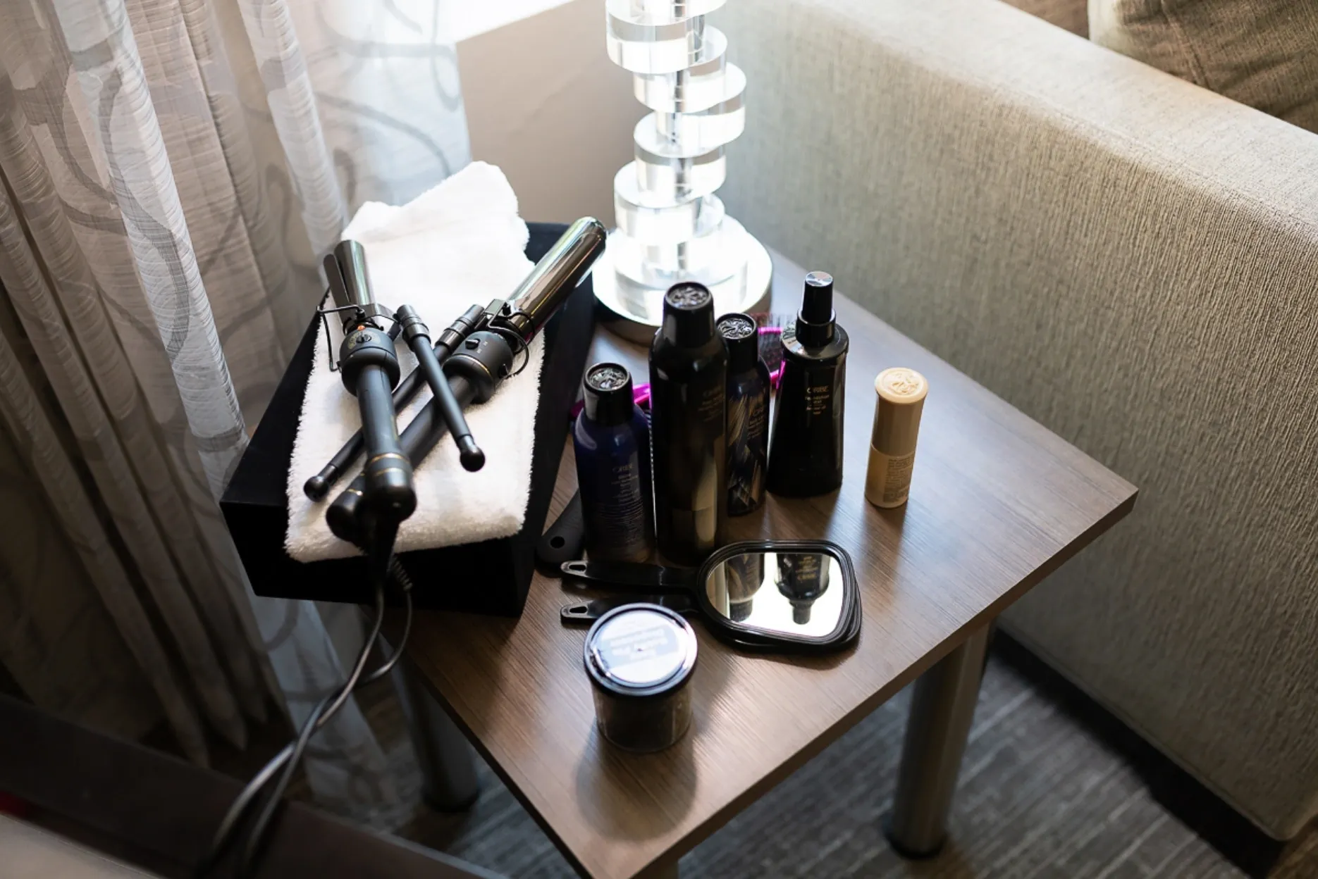 A table with some hair styling products on it