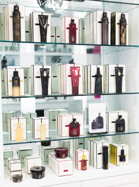 A display case filled with lots of different perfumes.