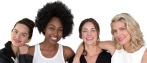 Two women smiling for a picture while posing.