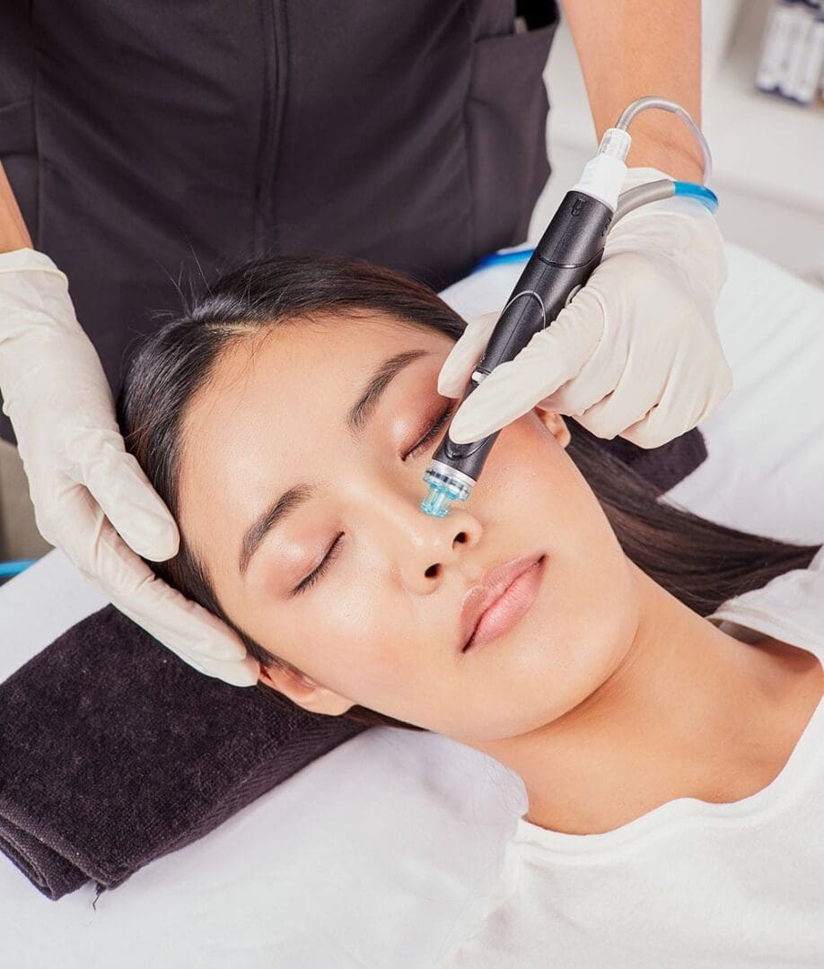 A woman getting her face waxed at the spa