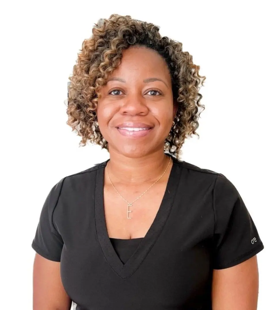 A woman with curly hair wearing a black shirt.