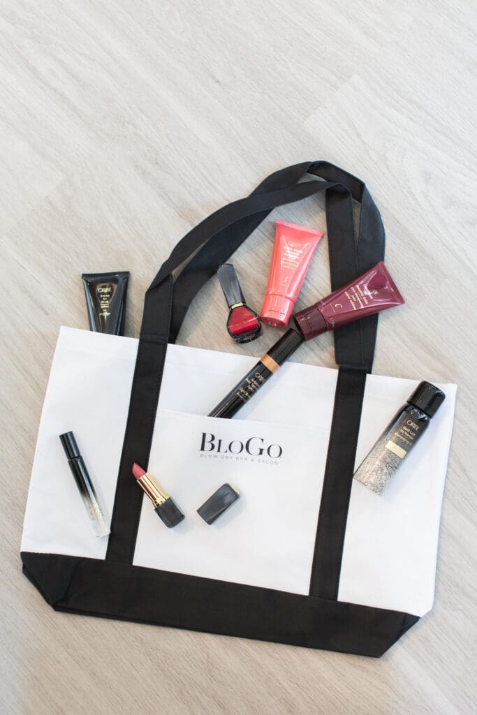 A bag of cosmetics sitting on top of the floor.