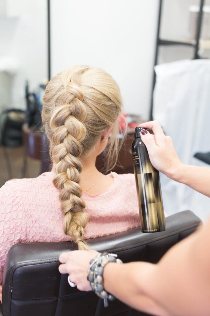 A woman getting her hair done at the salon