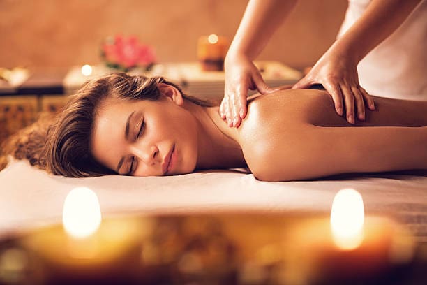 Beautiful woman receiving back massage at the spa.